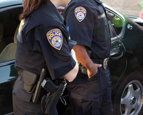 CDI detectives prepare to execute an arrest warrant on Melody Ann Mosqueda