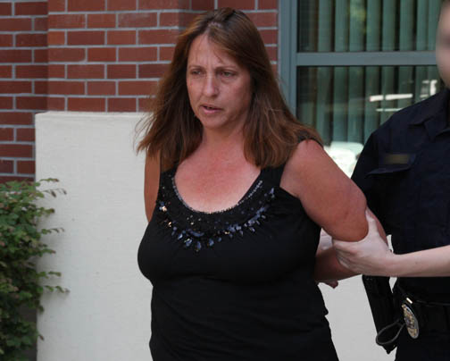 A CDI detective arrests Melody Ann Mosqueda at the San Joaquin County Superior Court