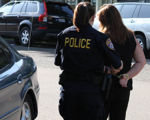 undefinedA CDI detective leads Melody Ann Mosqueda away after arresting her at the San Joaquin County Superior Court