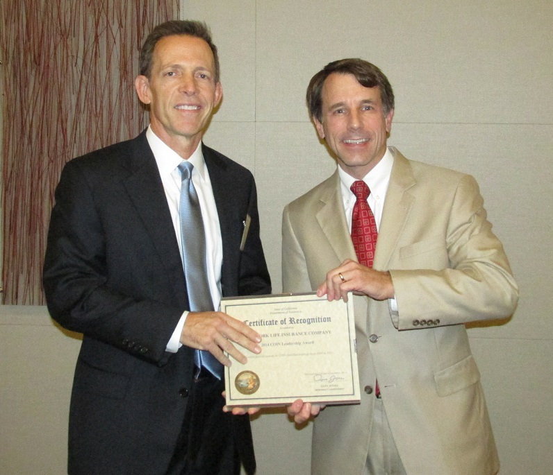 Kirk Kniss accepting a Leadership Award from the Commissioner on behalf of New York Life for the greatest percent increase in COIN qualified holdings from 2009 to 2012.